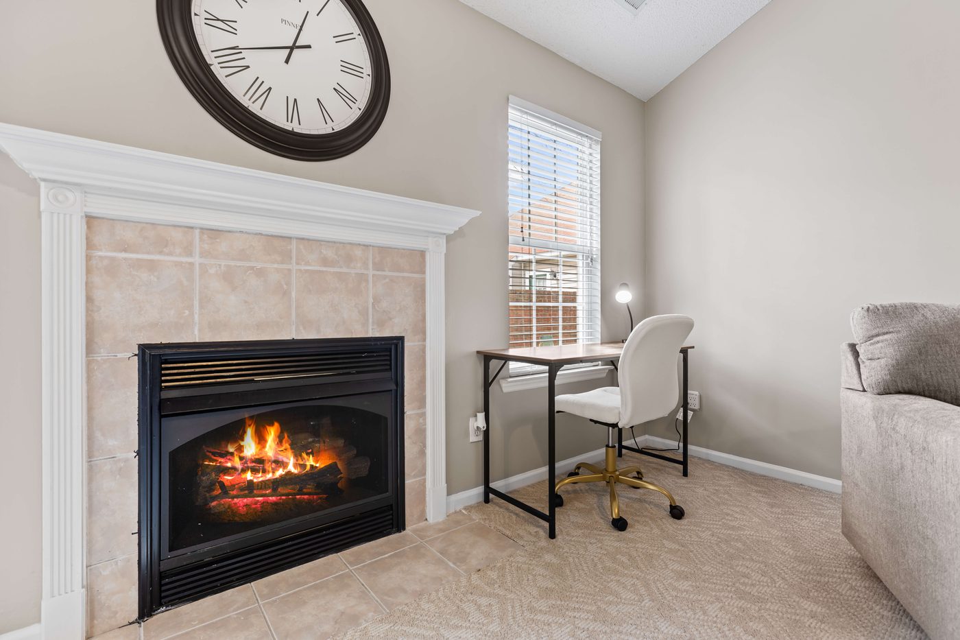 Living room fireplace with an adjacent corner desk work nook